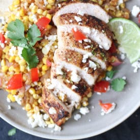 Mexican chicken and corn served on a plate.