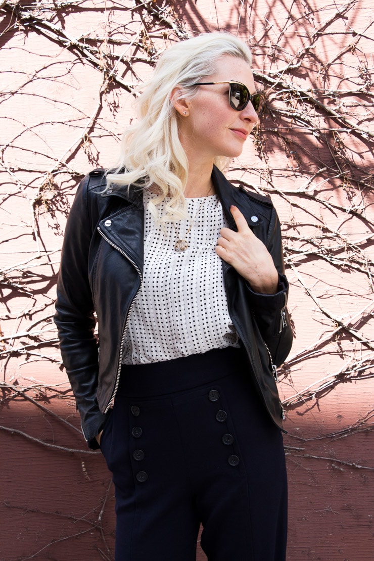 Blonde women standing outside.