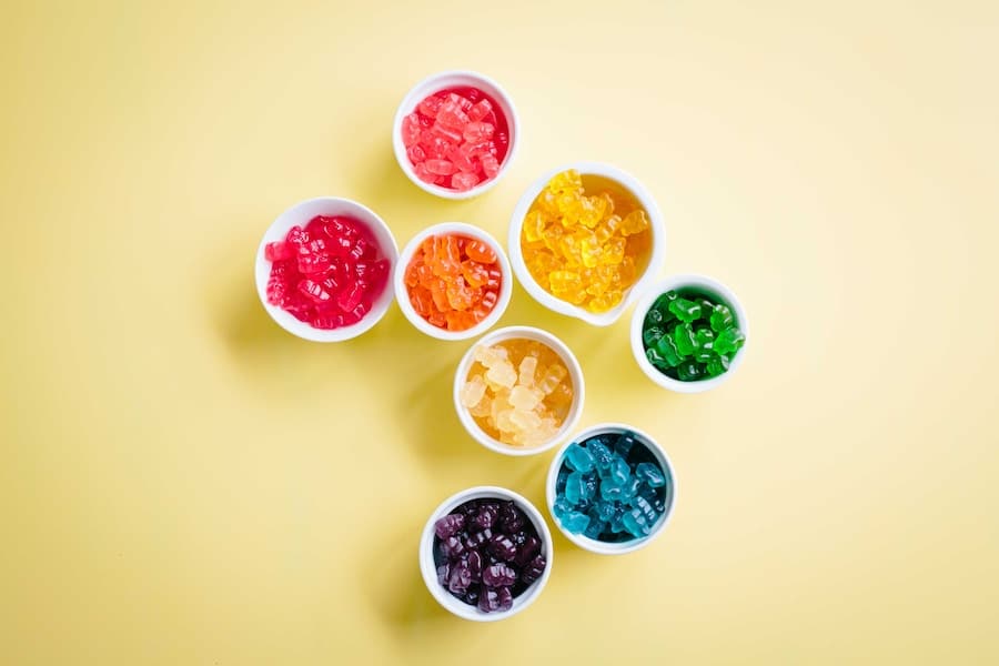 A bunch of bowls of different coloured gummy candies.