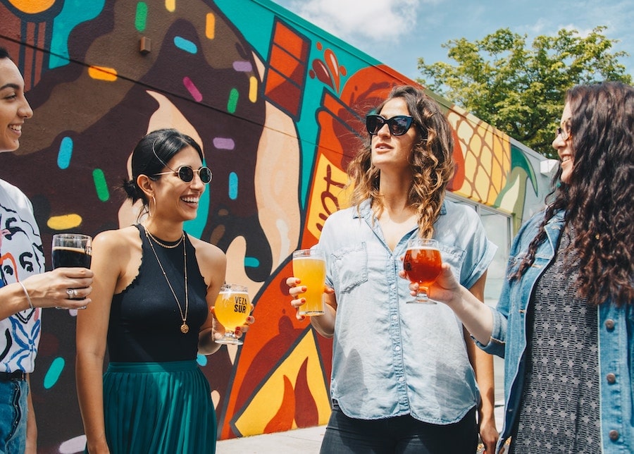 A group of women drinking alcohol.