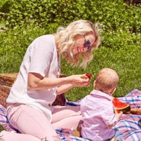 Abbey having a picnic with her baby.