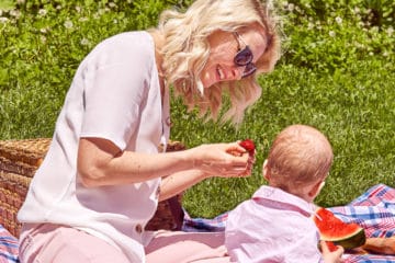 Abbey having a picnic with her baby.