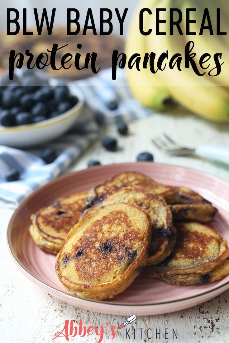 pinterest image of baby cereal protein pancakes on a pink plate with text overlay