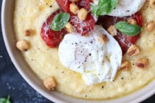 Creamy polenta with poached eggs and roasted tomatoes.