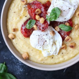 Creamy polenta with poached eggs and roasted tomatoes.