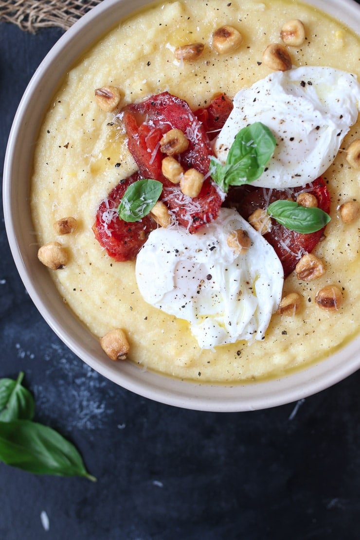 Creamy polenta with poached eggs and roasted tomatoes. 