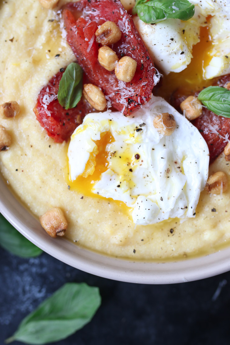 Creamy polenta with poached eggs and roasted tomatoes. 