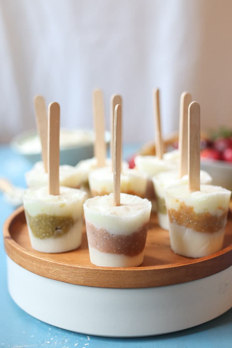 Baby popsicles on a wooden plate. 