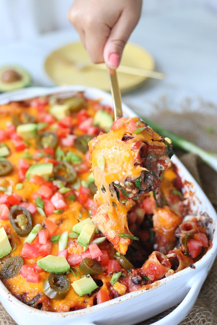 Gold spoon serving mexican casserole