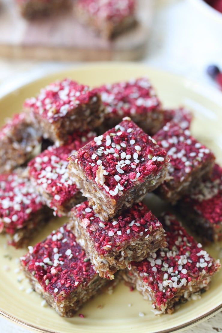 Close up of granola bars on a yellow plate. 