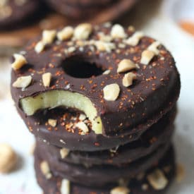 Chocolate covered pineapple slices on a teal plate.