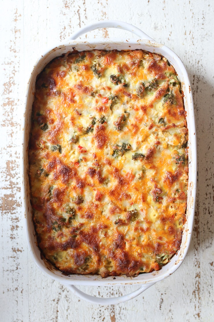 Overhead image of a cauliflower rice casserole in a white baking dish.