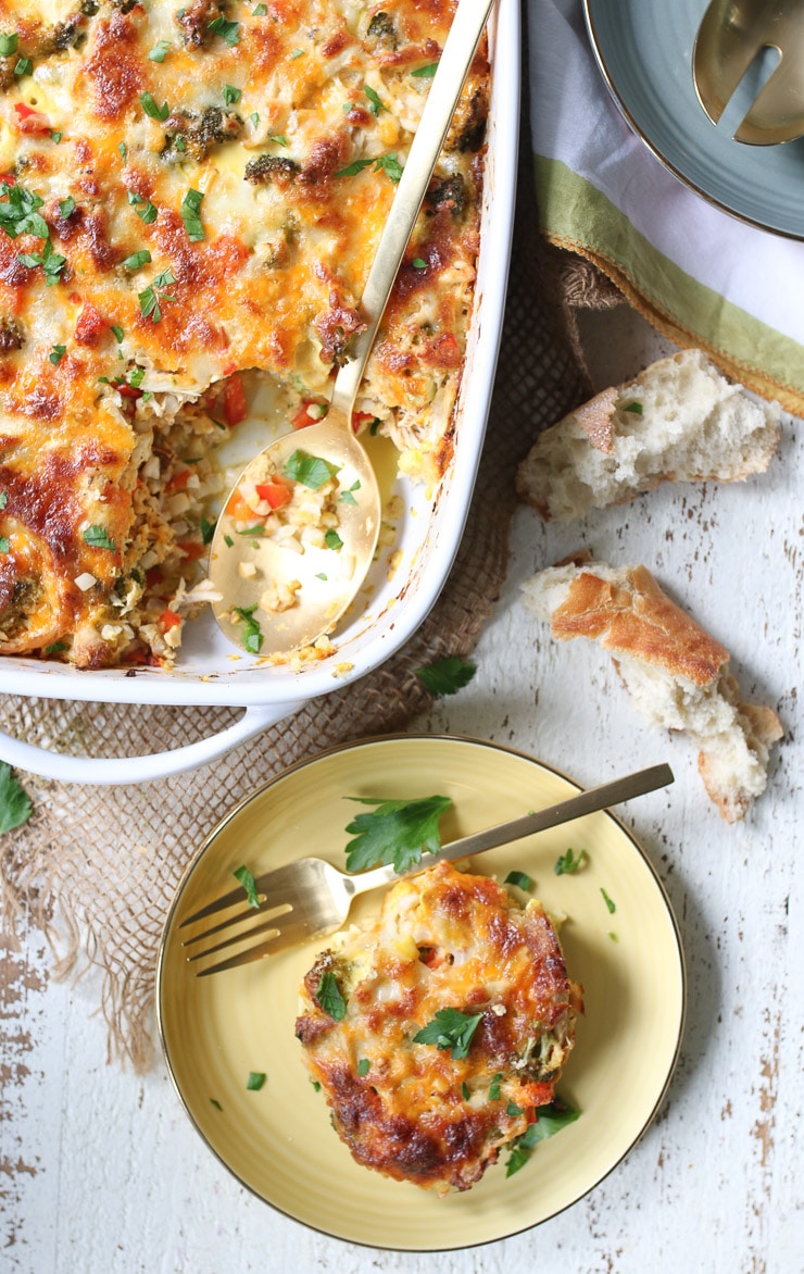 Overhead image of a serving of cauliflower casserole cut out of a baking dish and placed on a plate.