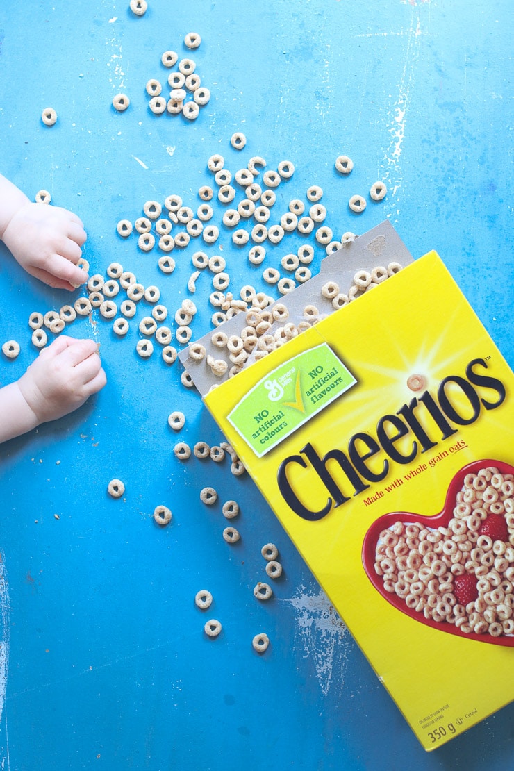 Baby's hand reaching for cereal.