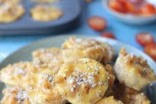 Mac and cheese bites on a blue plate.