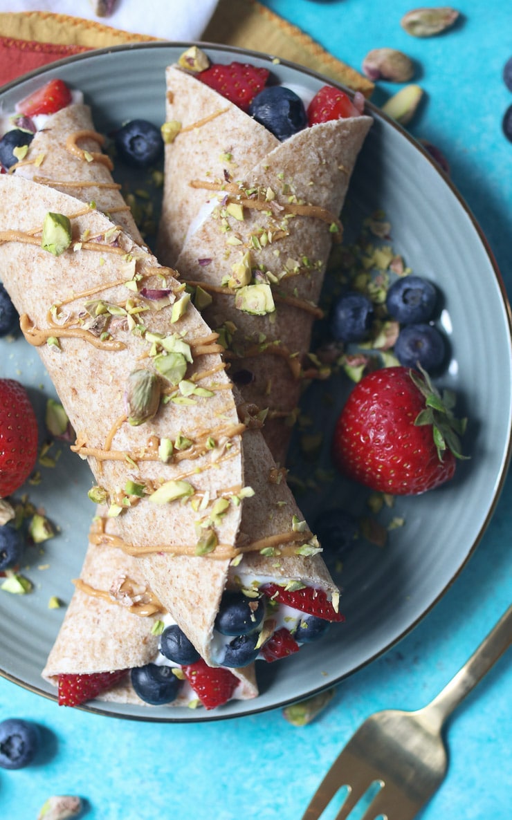 Crepes stuffed with yogurt and berries