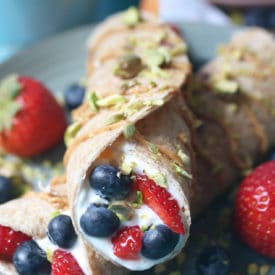 Crepes stuffed with yogurt and berries.