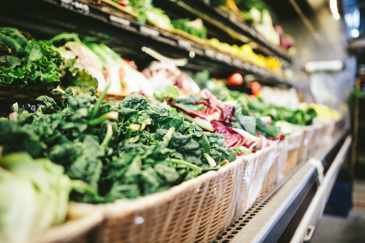 Selection of greens at a grocery store.