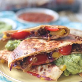 Vegan quesadilla on a yellow plate.