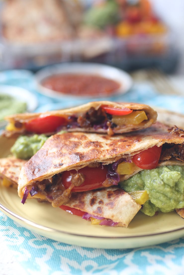 Vegan baked quesadillas on a yellow plate.