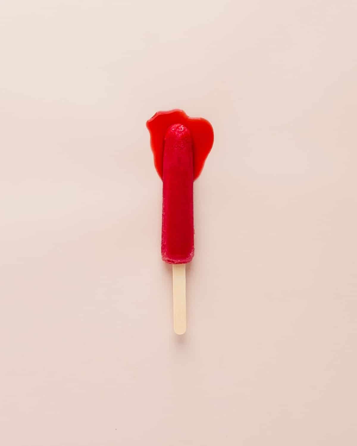 Melting red popsicle