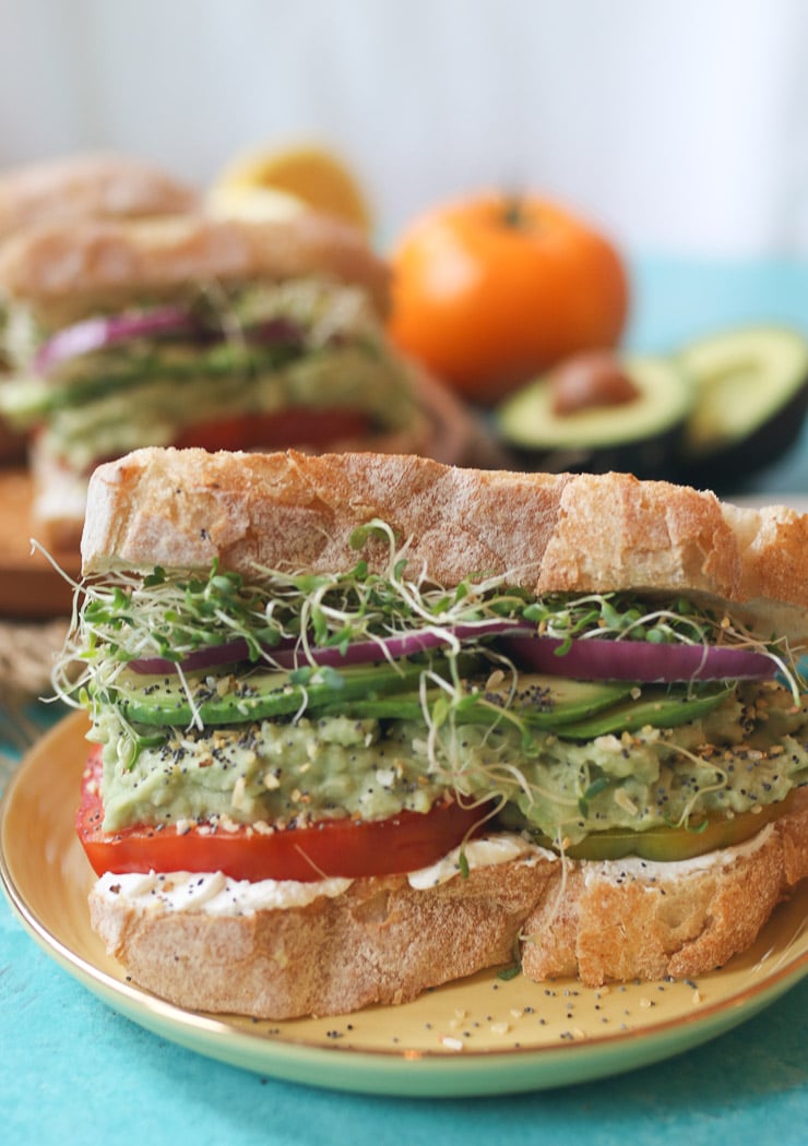 vegan sandwich on a yellow plate.