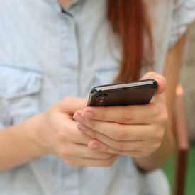 Hands holding a cellphone