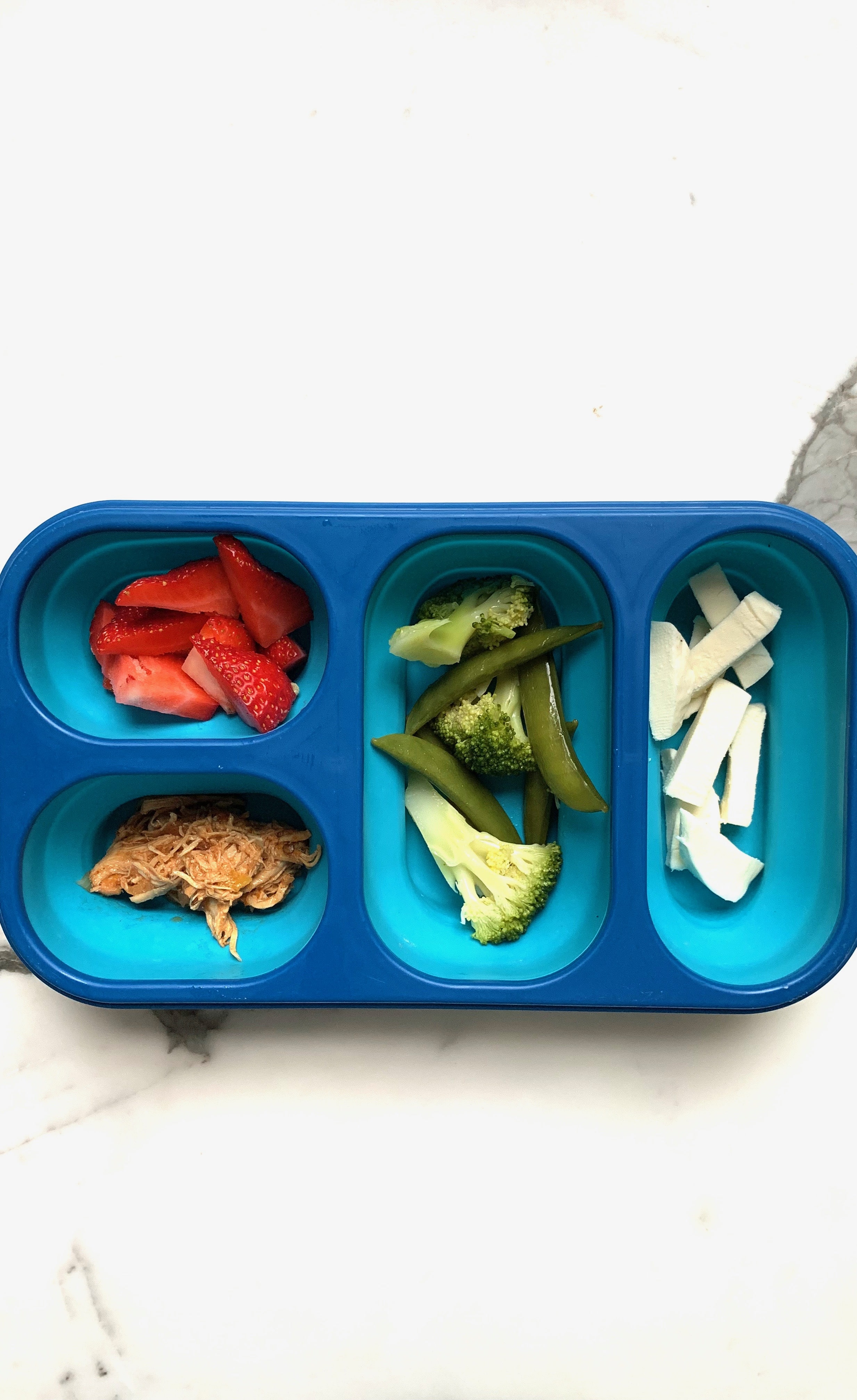 Toddler lunchbox filled with fruits and veggies. 