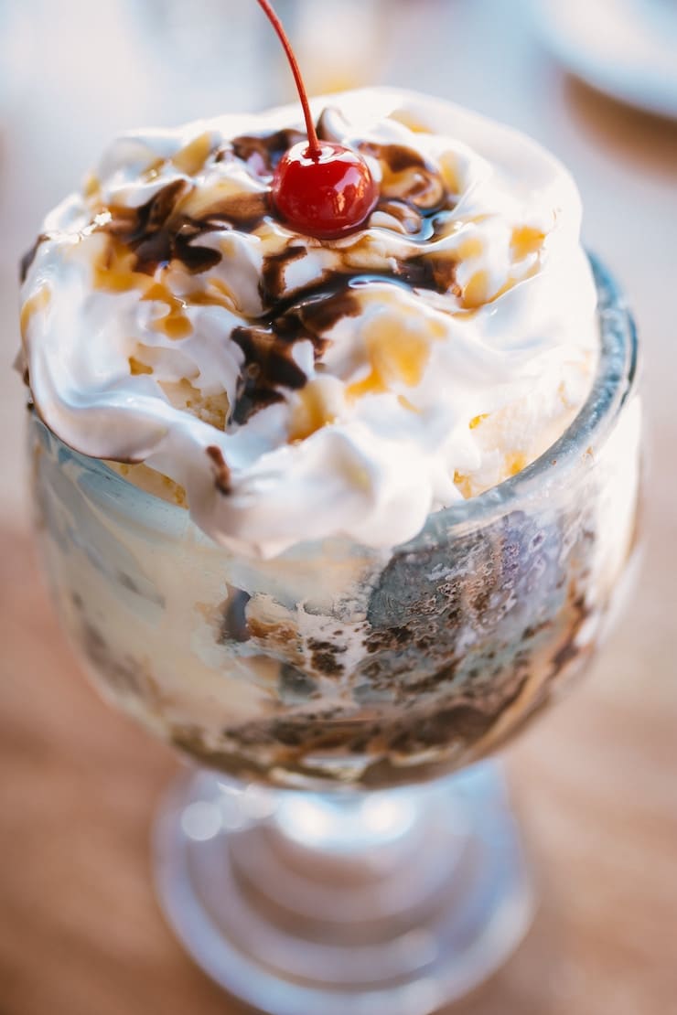 close up image of an ice cream parfait in a clear glass