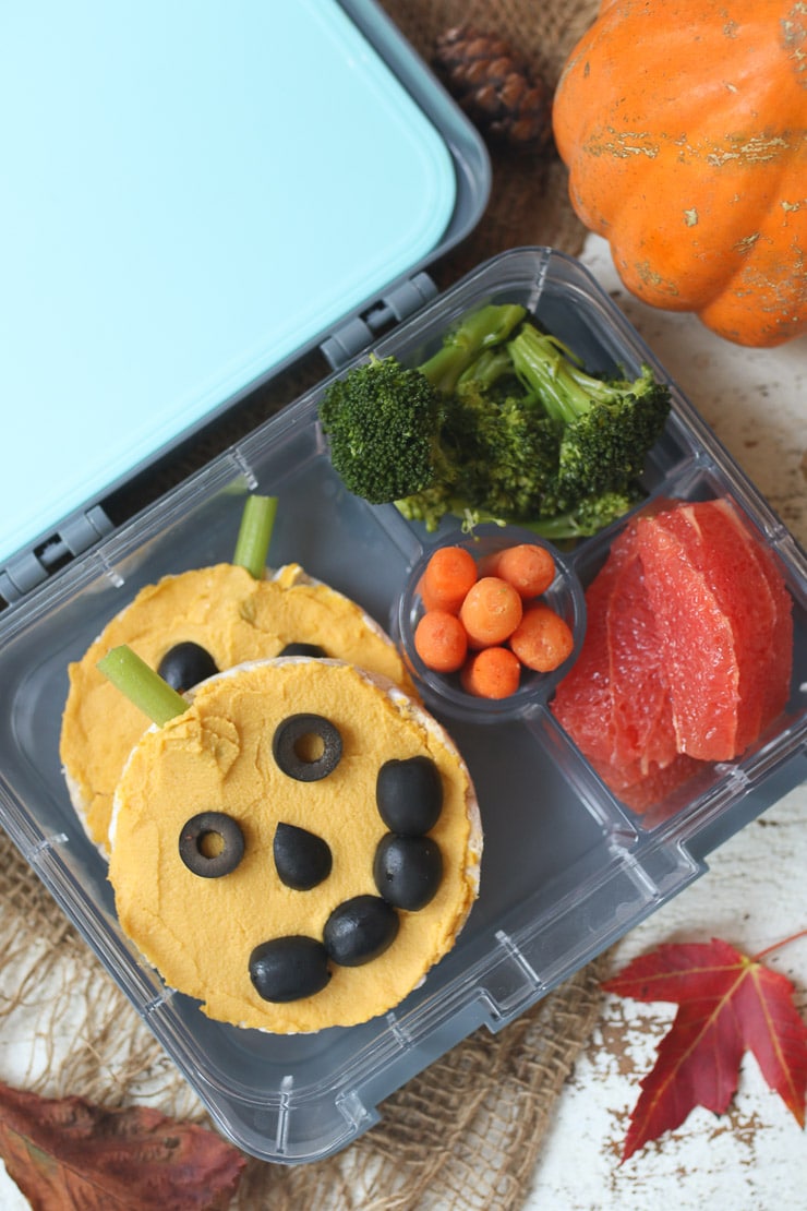 Pumpkin hummus rice cakes in a lunchbox.