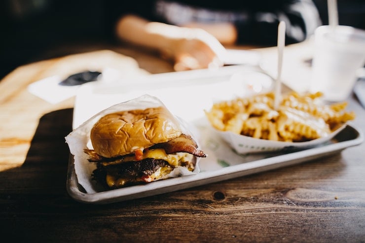 Burger and fries on a tray. 