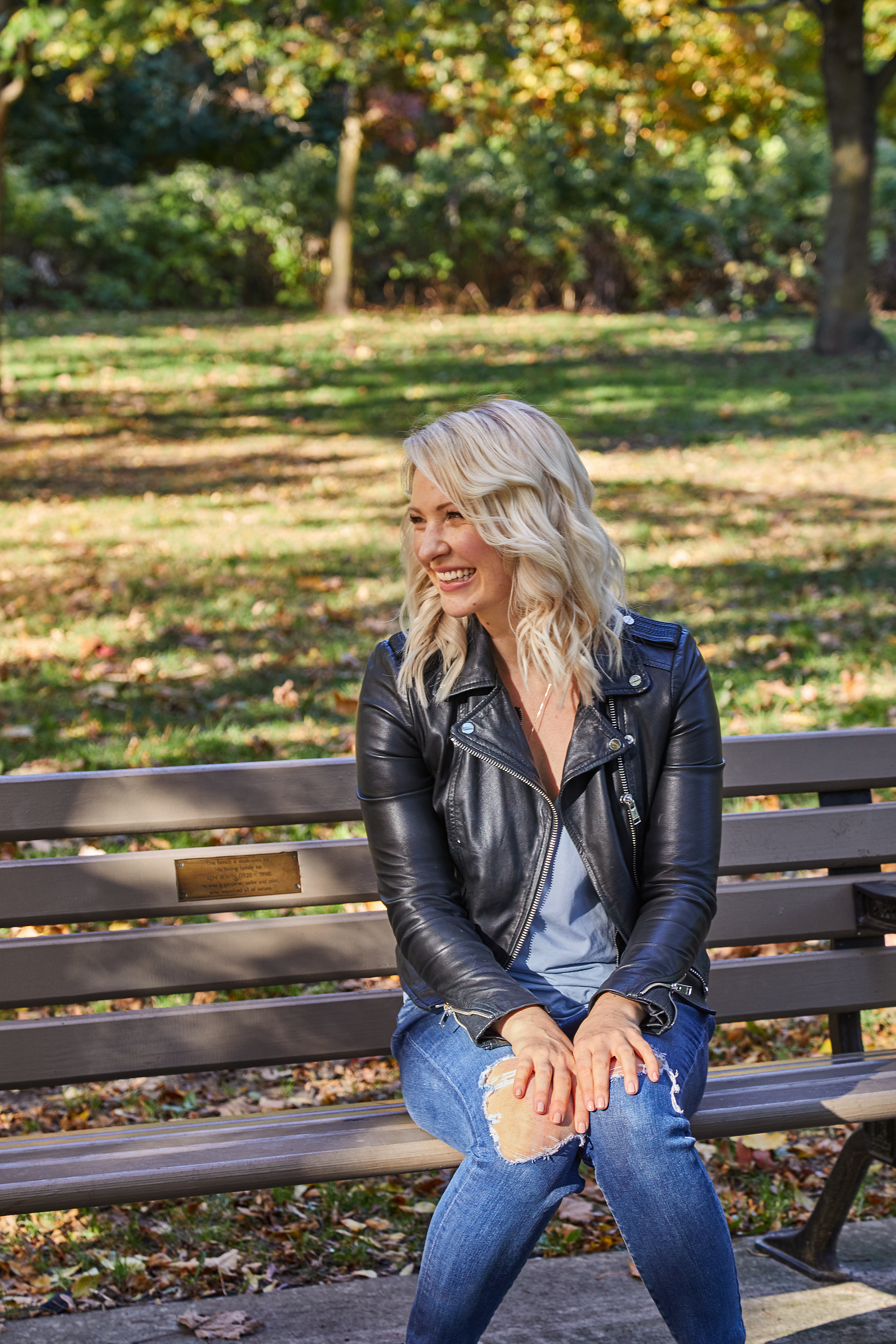 Women sitting on a park bench. 