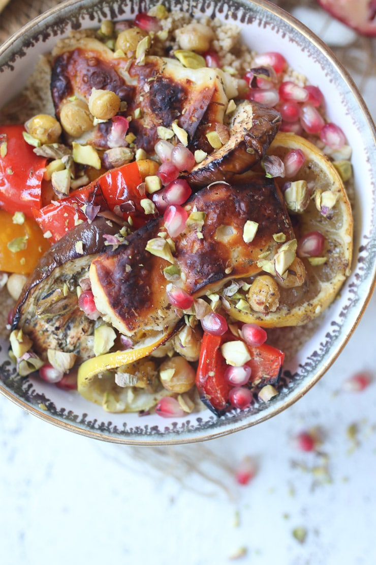 birds eye view of Halloumi and vegetables in a bowl garnished with pomegranate seeds 