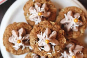 Pile of cookie cups on a white plate.