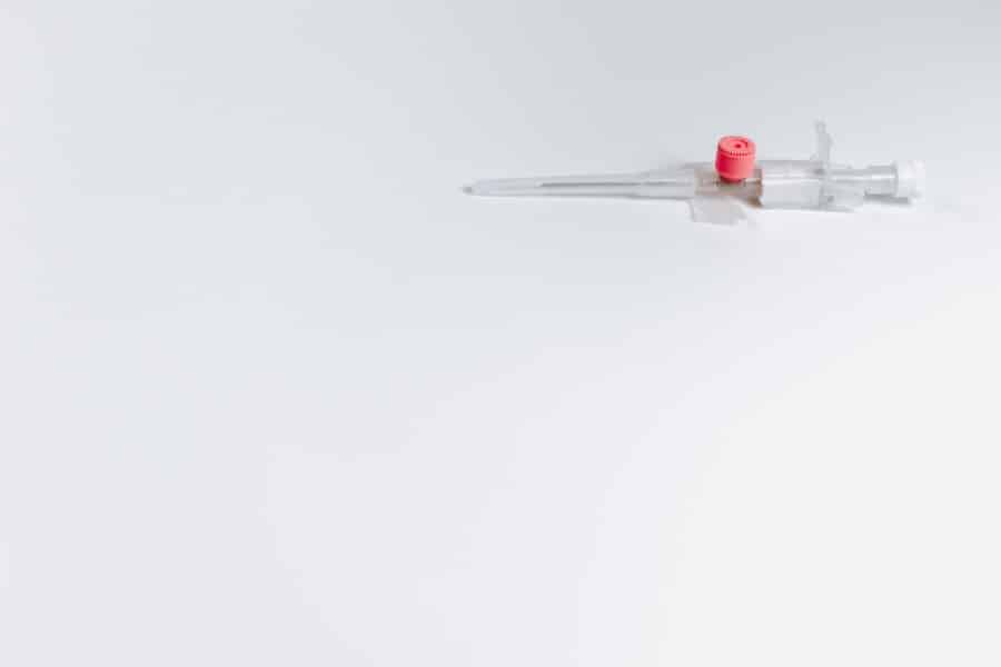 Injection syringe on a white background.