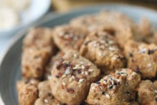 Tofu nuggets on a plate topped with everything bagel spice.