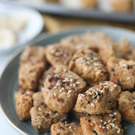 Tofu nuggets on a plate topped with everything bagel spice.