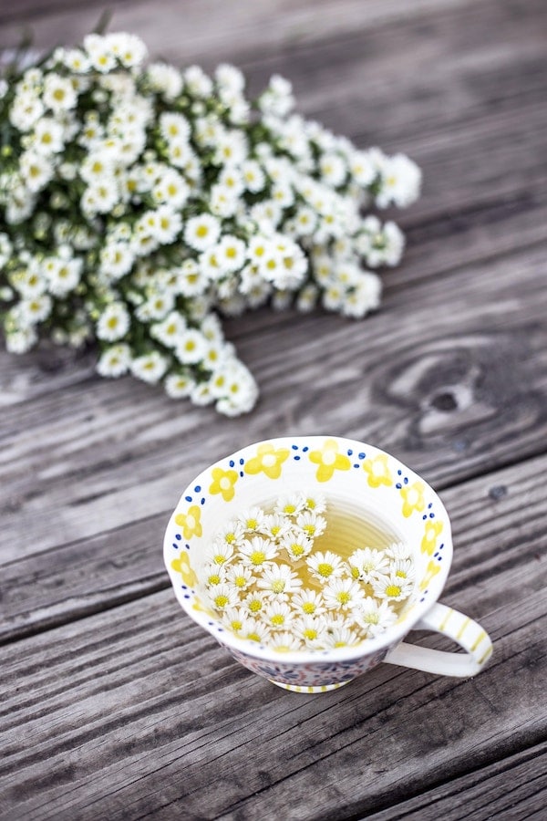 Chamomile tea in a mug for bloating