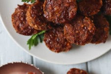 Mini meatloaf muffins on a white plate.