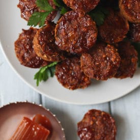 Mini meatloaf muffins on a white plate.