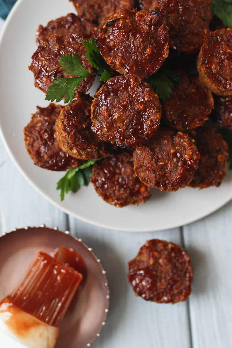 Mini vegan lentil meatloaf muffins on a white plate. 