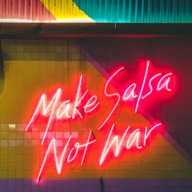 Neon sign about making peace with food.