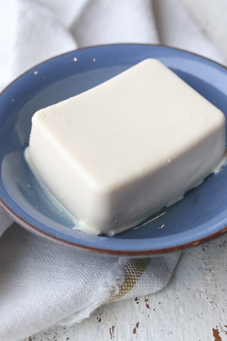 close up image of tofu in a blue bowl representing soy as a part of a heart healthy diet 