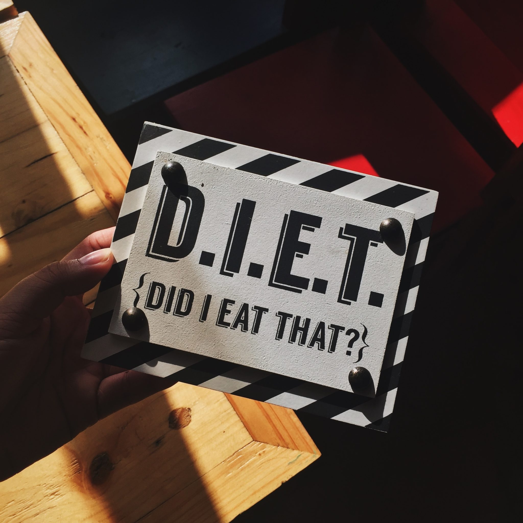 sign representing food police that displays "diet" as an acronym for "Did I Eat That?"