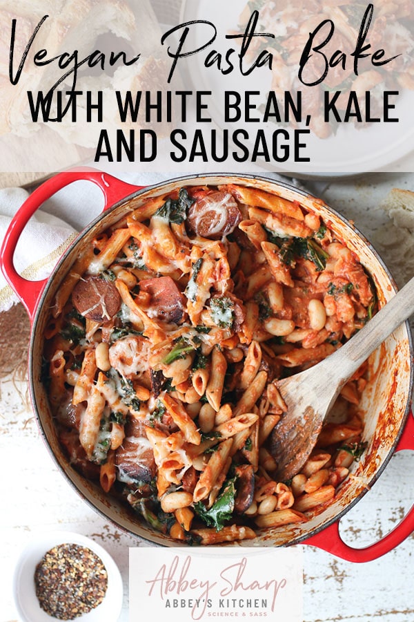 pinterest image of pasta bake in red baking dish with wooden spoon in the middle with text overlay