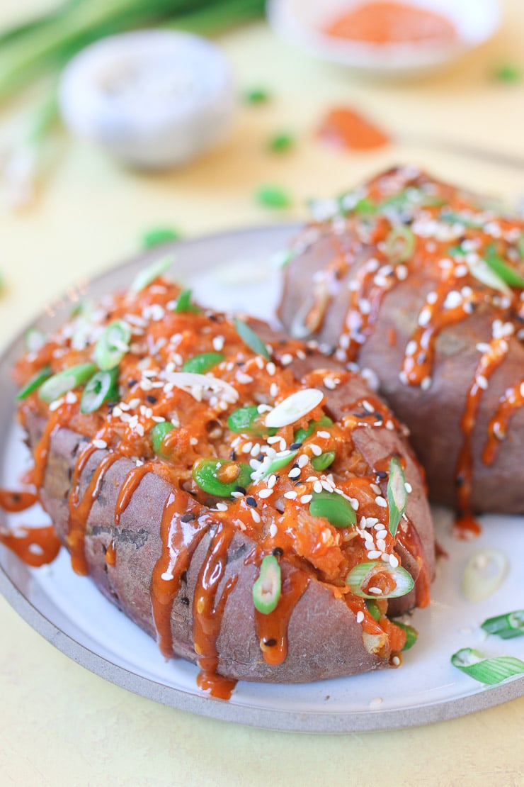 Korean stuffed sweet potato topped with green onion and sesame seed