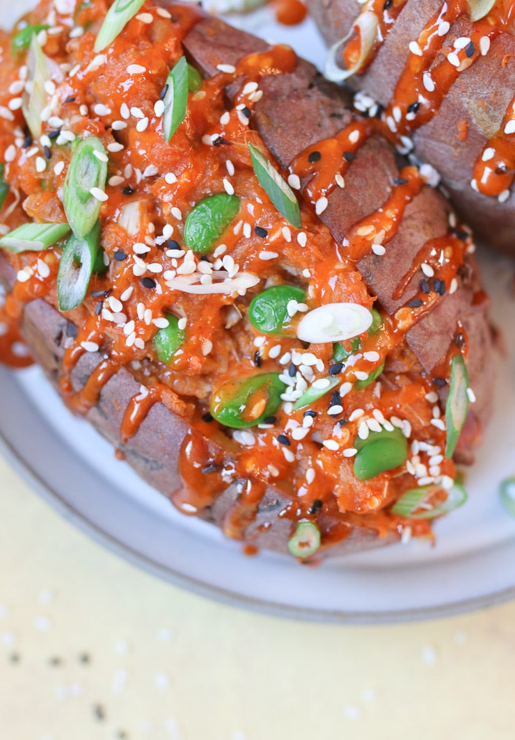 Korean stuffed sweet potato topped with green onion and sesame seed