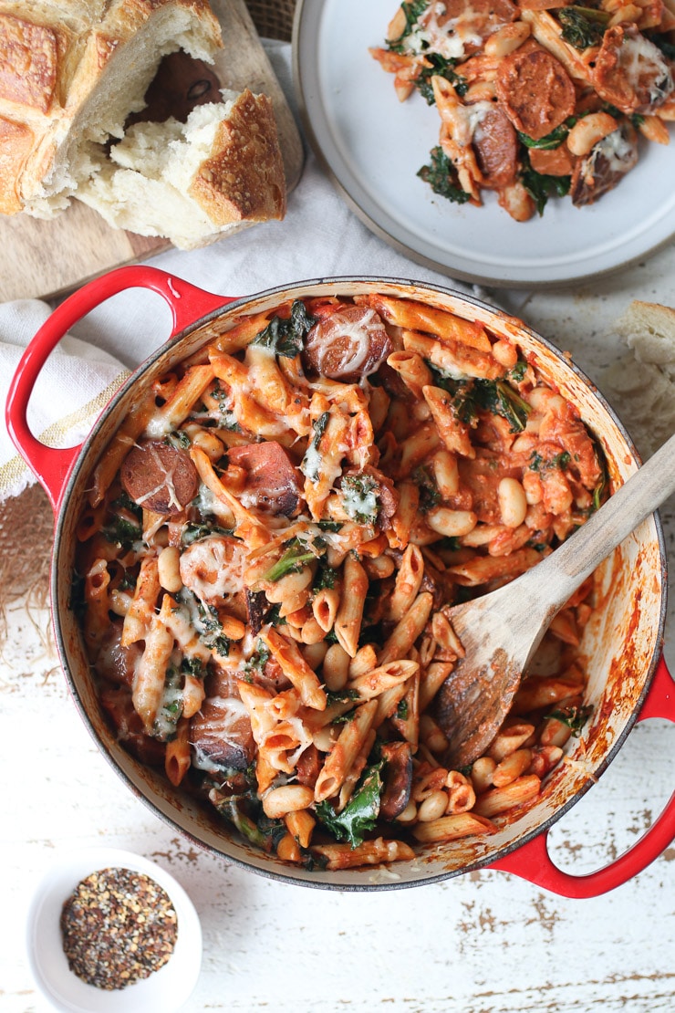 birds eye view of pasta bake in red casserole dish 