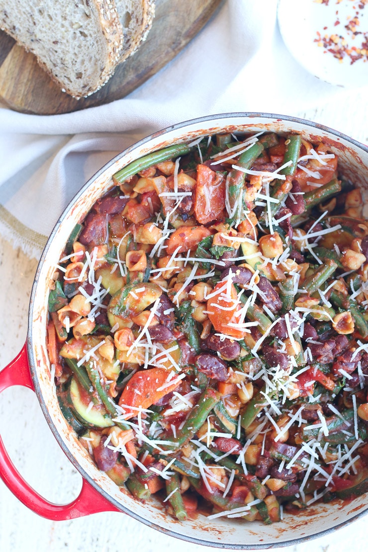 birds eye view of vegan minestrone skillet pasta on a red pot