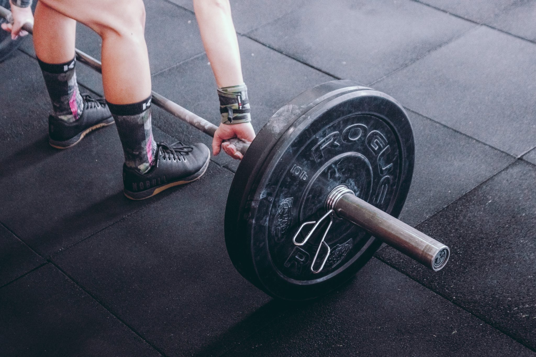 Female bodybuilder lifting a weight 